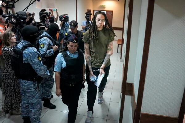 WNBA star and two-time Olympic gold medalist Brittney Griner is escorted to a courtroom prior to a hearing, in Khimki, just outside Moscow, on Aug. 2, 2022. (Alexander Zemlianichenko/AP Photo)