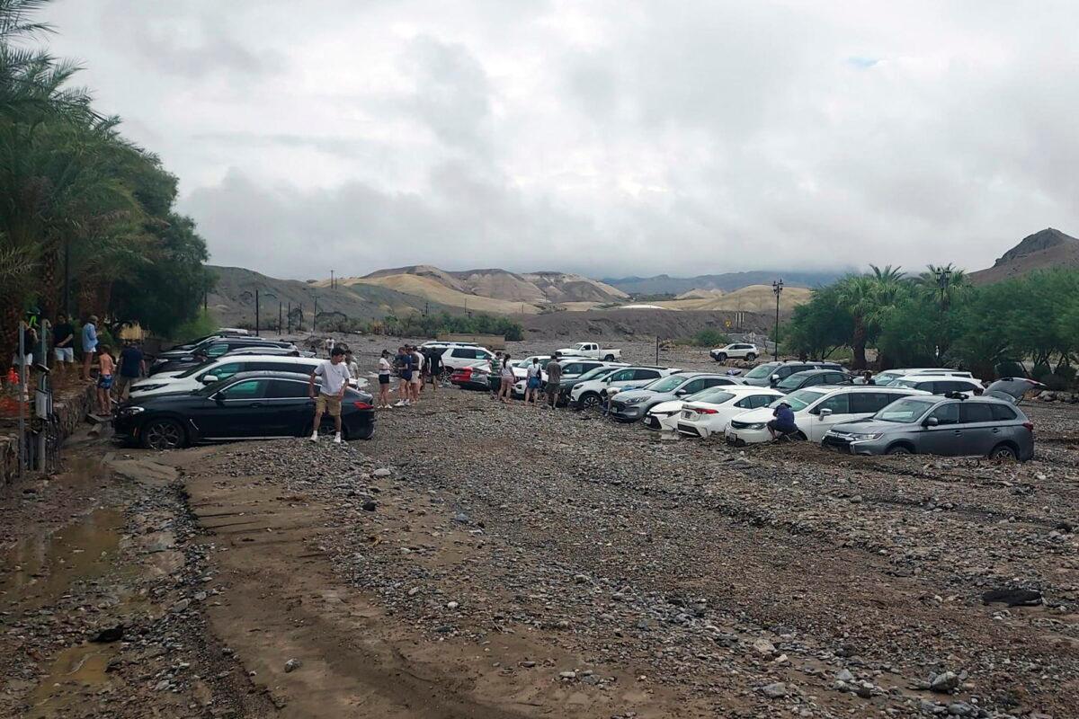 Cars are stuck in mud and debris from flash flooding at The Inn at Death Valley in Death Valley National Park, Calif., on Aug. 5, 2022. (National Park Service via AP)