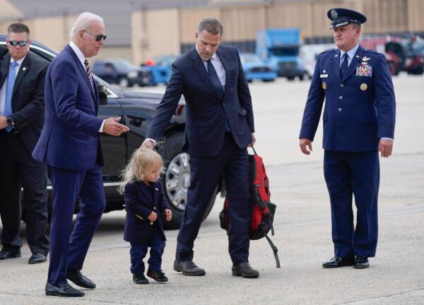 President Joe Biden walks with his son Hunter Biden and grandson Beau Biden to board Air Force One at Andrews Air Force Base, Md., on Aug. 10, 2022. (Manuel Balce Ceneta/AP Photo)