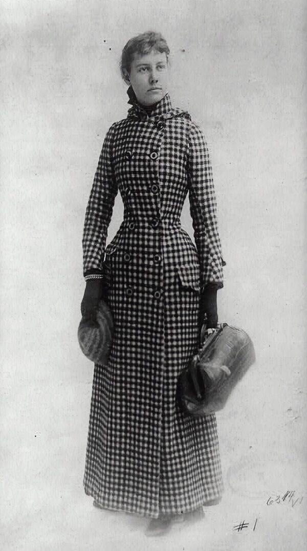 A journalist on the go, Bly poses with her carpetbag, 1890. (Public domain)