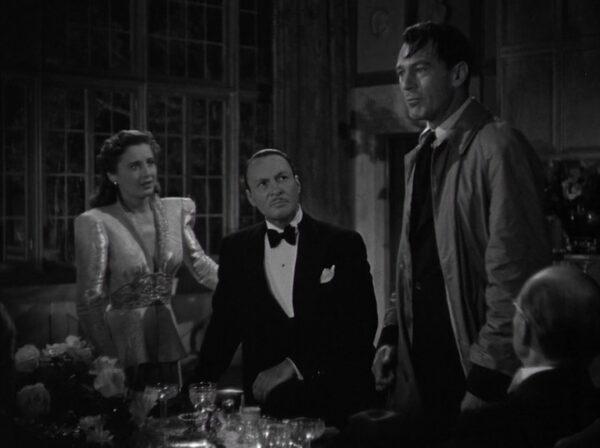 (L–R) Ann Mitchell (Barbara Stanwyck) and Ted Shelton (Rod LaRocque) hear Gary Cooper as Willoughby (Gary Cooper) make an impassioned plea, in "Meet John Doe." (Warner Bros.)