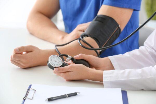 At the hospital, initial tests will include checking the patient’s blood pressure. (Shutterstock)