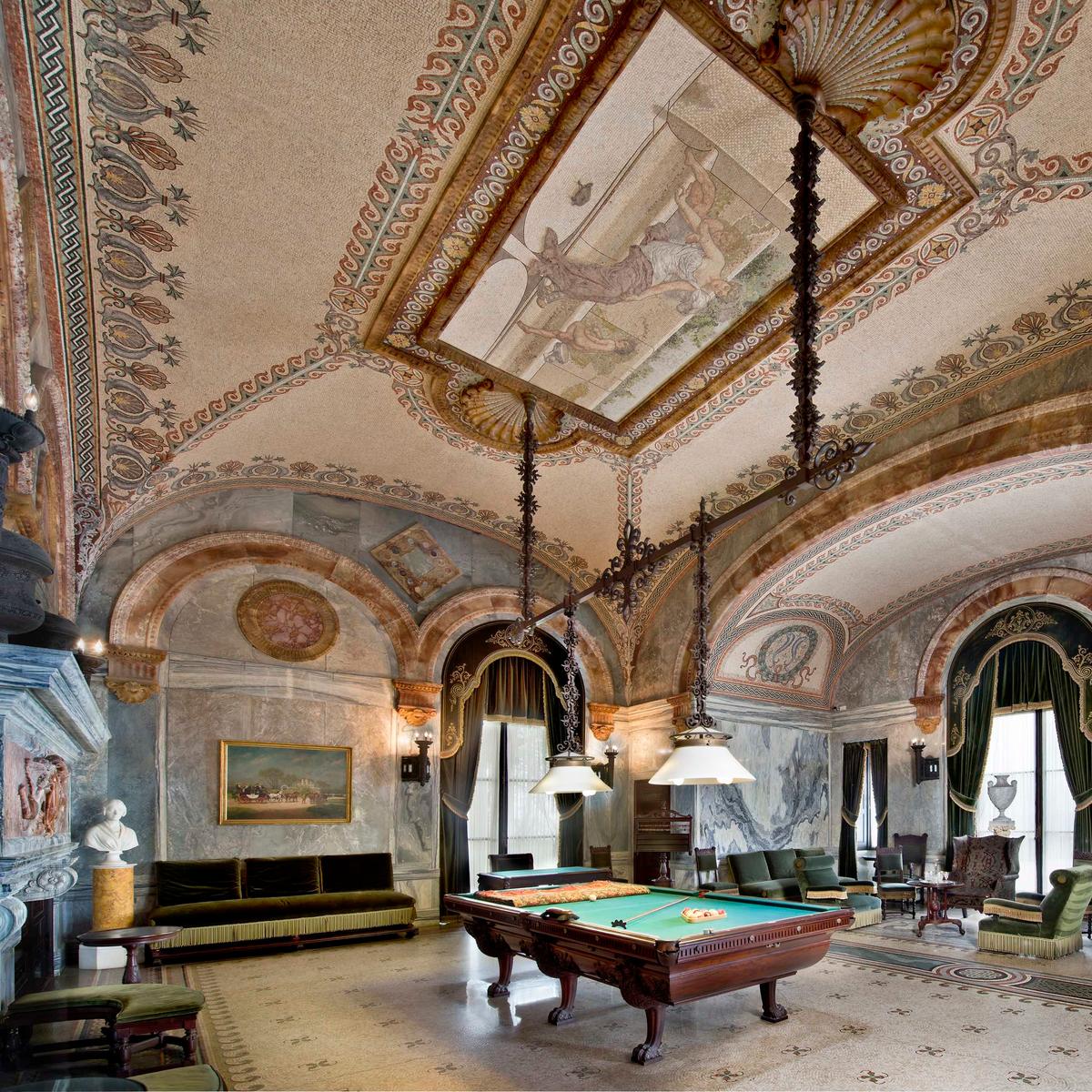 Designed by Richard Morris in the style of ancient Rome, the walls of the Billiard Room are constructed from slabs of Italian cippolino marble with rose alabaster arches. Semi-precious stones create mosaics. The Billiard Room was featured in the second episode of “The Gilded Age” series on HBO. (Courtesy of The Preservation Society of Newport County)