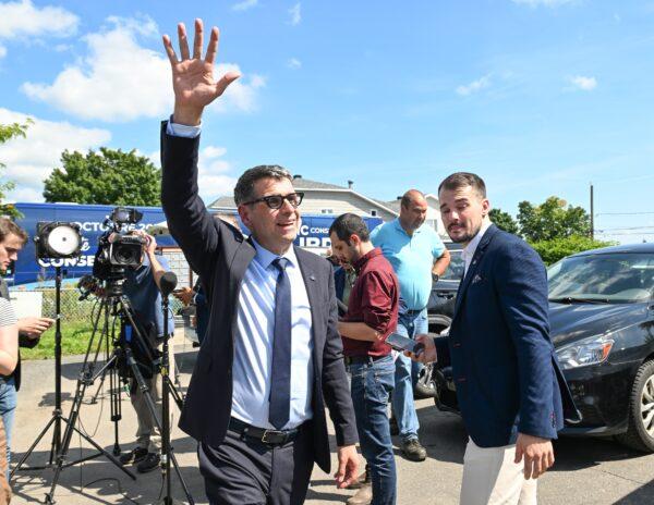 Quebec Conservative Leader Eric Duhaime waves to supporters at his campaign launch rally, on Aug. 28, 2022 in Quebec City.  (Jacques Boissinot/The Canadian Press)