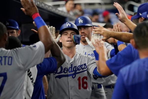 Los Angeles Dodgers' Will Smith (16) is congratulated by his teammates after hitting a home run in the third inning of a baseball game against the Miami Marlins in Miami, Aug. 29, 2022. (Marta Lavandier/AP Photo)