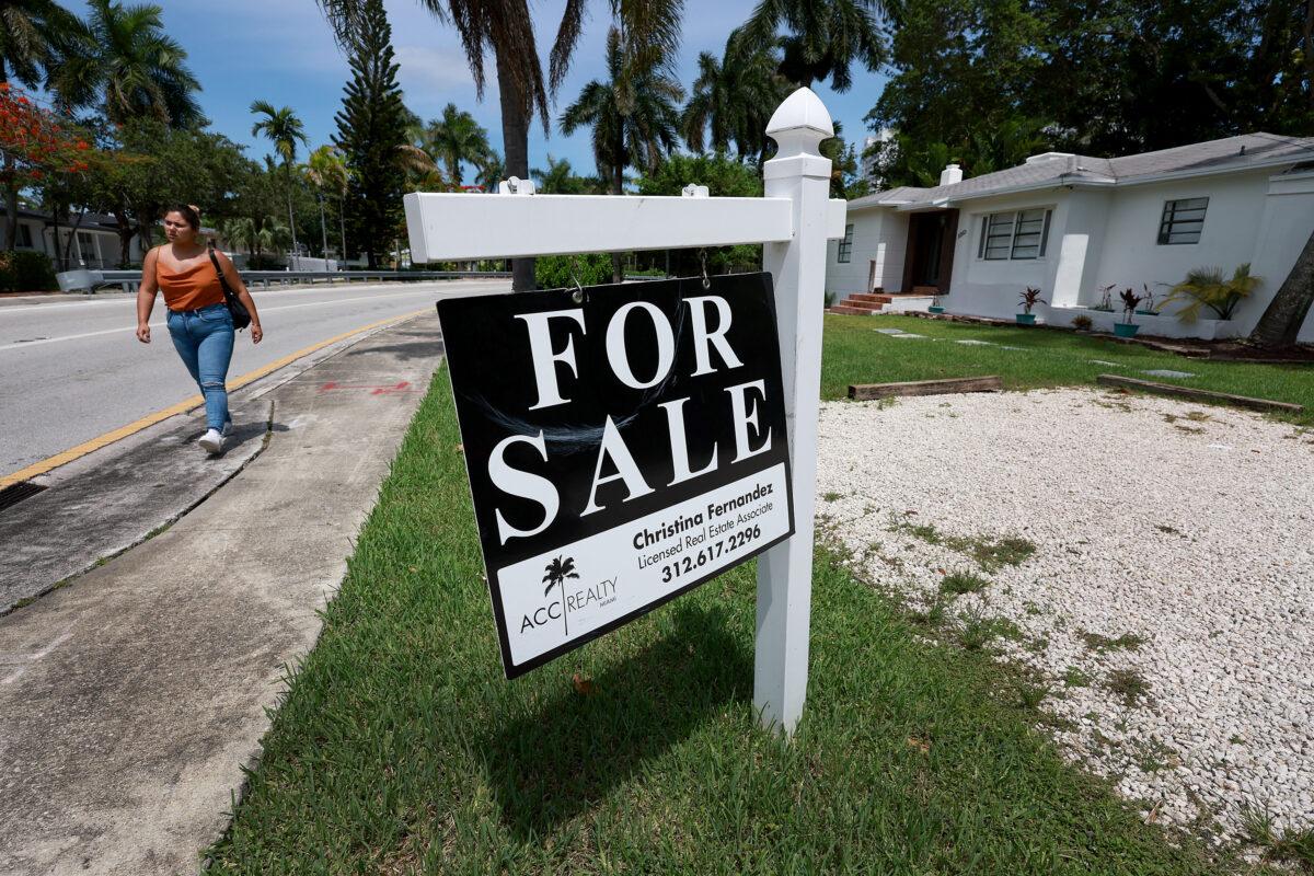 A 'for sale' sign hangs in front of a home in Miami on June 21, 2022. (Joe Raedle/Getty Images)