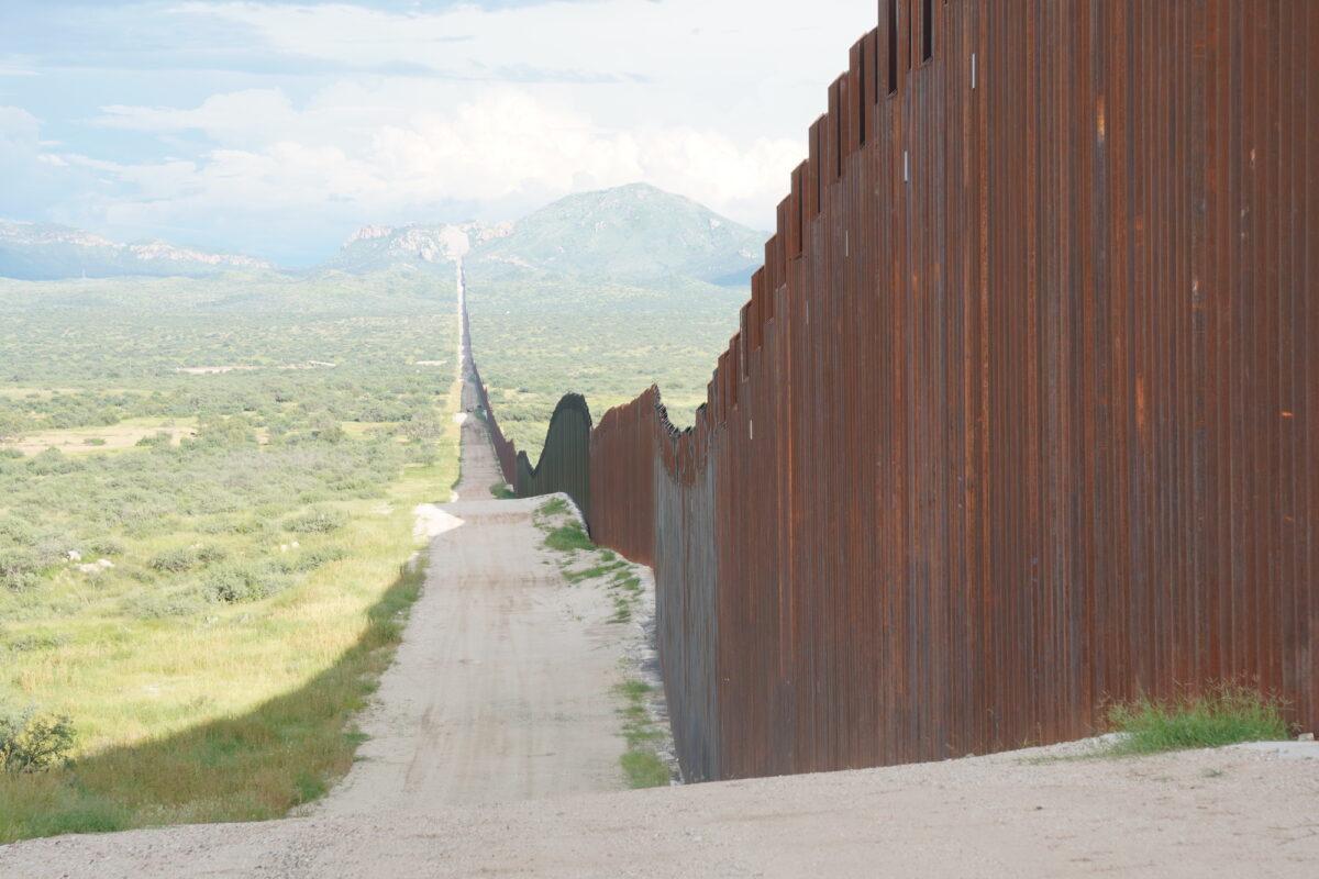 The Roosevelt Easement is a 60-foot-wide stretch of federal land spanning three U.S. border states, including Arizona. Here, the easement runs parallel to the border wall in Douglas, Ariz., on Aug. 24, 2022. (Allan Stein/The Epoch Times)