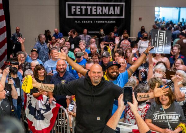 Pennsylvania Democratic Senate candidate Lt. Gov. John Fetterman celebrates with supporters after a rally in Erie, Pa., on Aug. 12, 2022, while campaigning against Republican hopeful Mehmet Oz in a "tossup" race that could be determined by Latino voters. (Nate Smallwood/Getty Images)