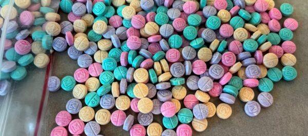 Brightly colored counterfeit M30 oxycodone pills in a file photo. (Courtesy of the U.S. Drug Enforcement Administration)