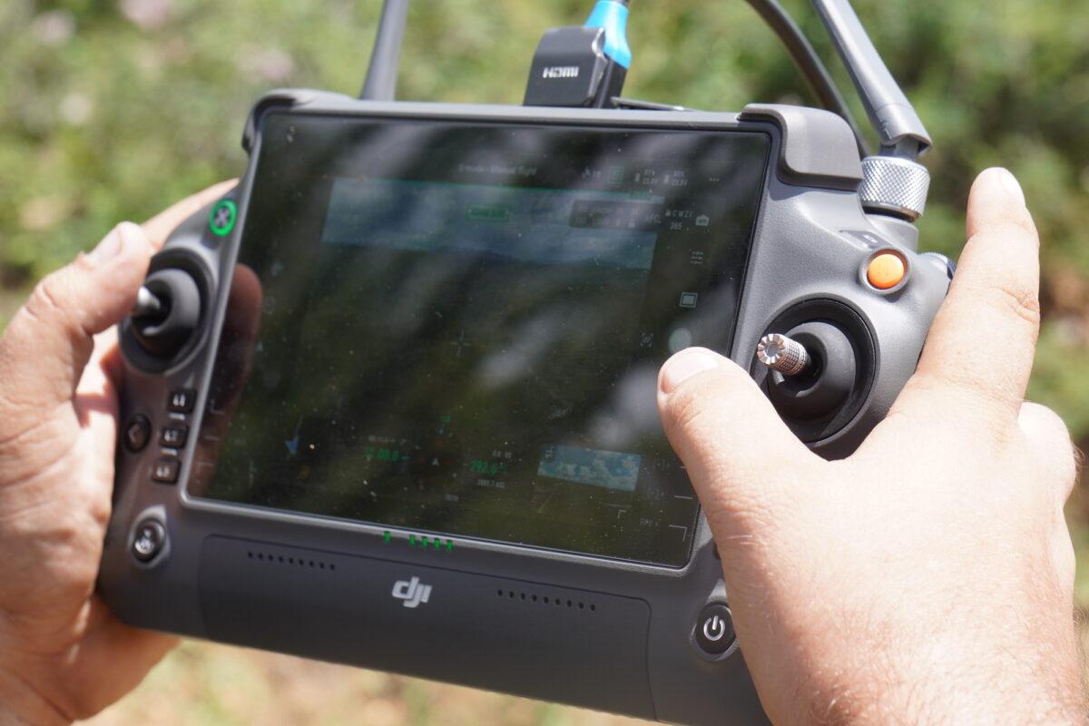 Kyle, a private security specialist in Arizona, operates a surveillance drone using an electronic console just east of Arivaca, Ariz., on Aug. 25. (Allan Stein/The Epoch Times)