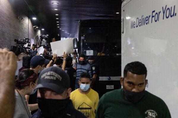 A bus carrying illegal immigrants sent from Texas arrives at Port Authority Bus Terminal in New York, on August 10, 2022. (Yuki Iwamura/AFP via Getty Images)