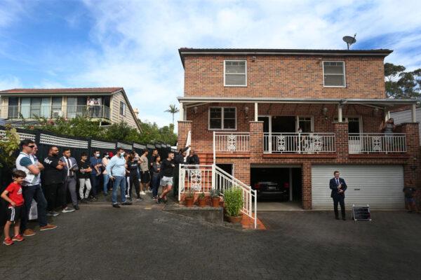 An auctioneer counts down a bid during an auction of a residential property in Sydney, Australia, on May 8, 2021. (Lisa Maree Williams/Getty Images)