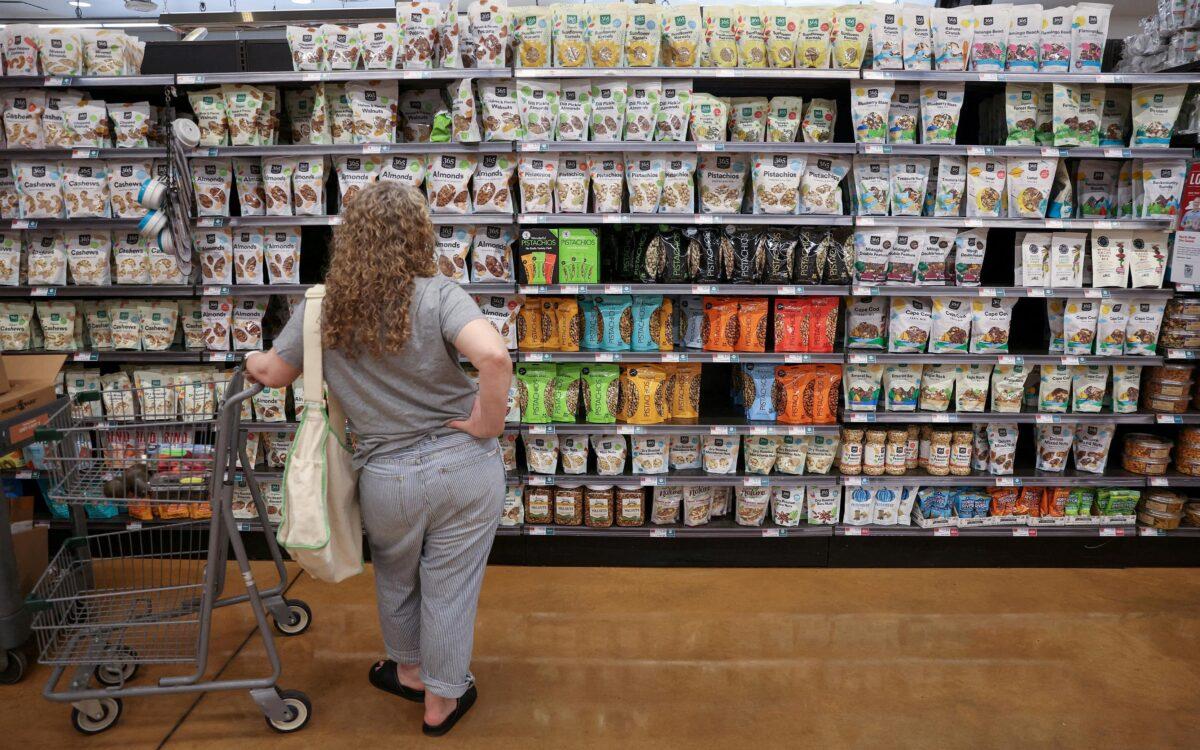 A person shops in a supermarket as inflation affects consumer prices in Manhattan, New York City, on June 10, 2022. (Andrew Kelly/Reuters)