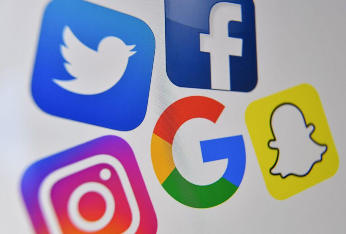 A photo shows the logos of Facebook, Twitter, Instagram, Google, and Snapchat. (Denis Charlet/Getty Images)