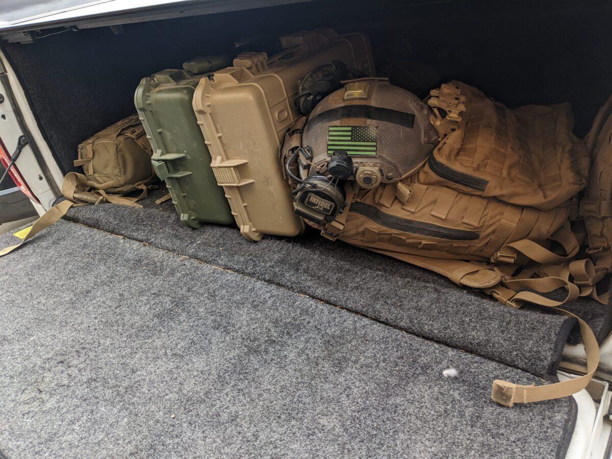 An Arizona private security firm keeps high-tech equipment, including a surveillance drone, secure in heavy-duty suitcases in the back of a company pickup truck on Aug. 25. (Allan Stein/The Epoch Times)