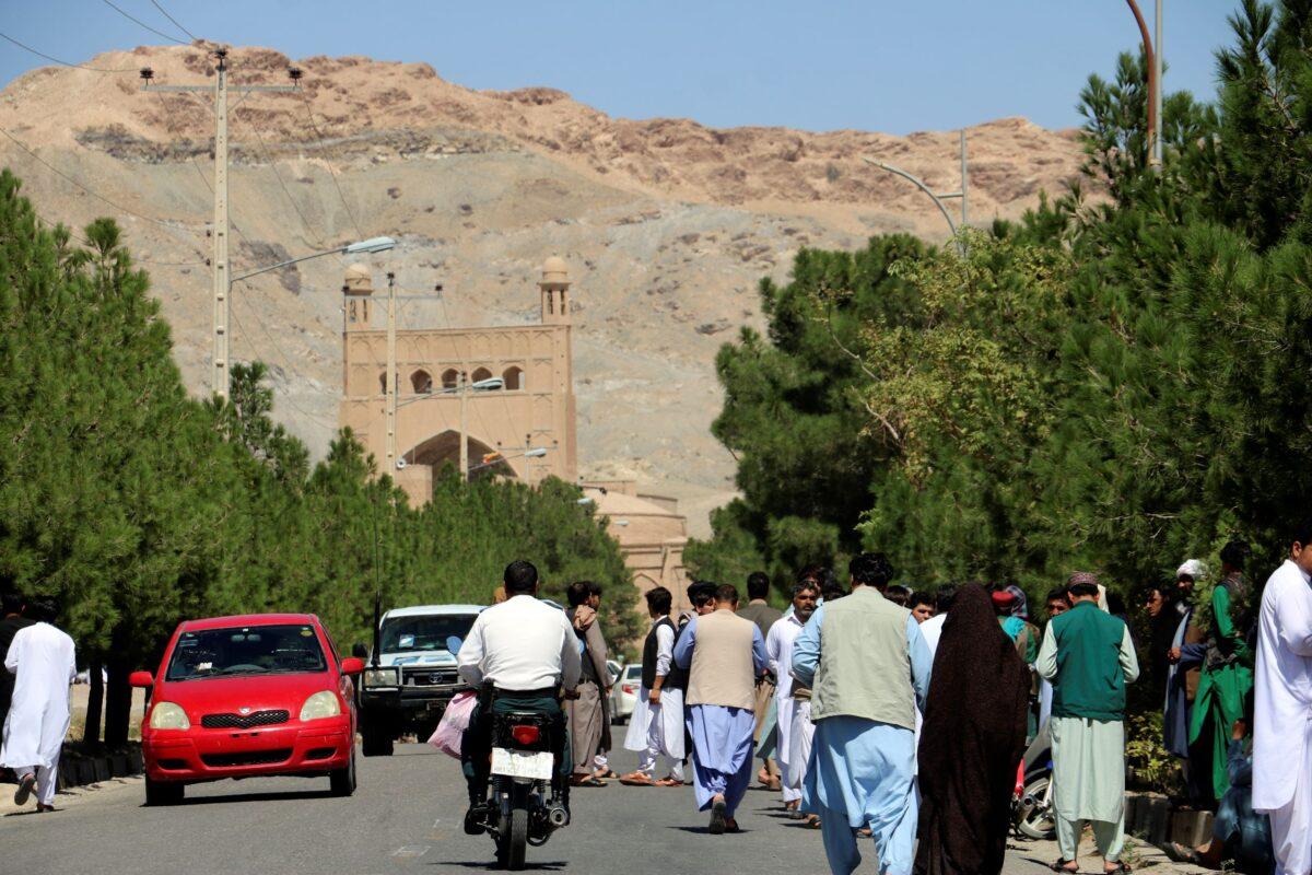 Afghan people gather near the site of an explosion in Herat province, Afghanistan, on Sept. 2, 2022. (Omid Haqjoo/AP Photo)