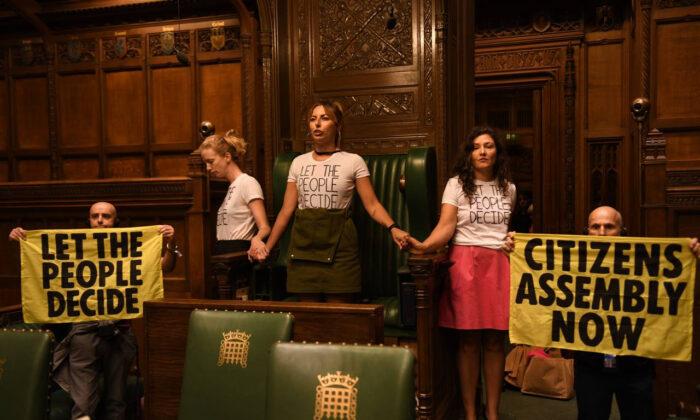 Extinction Rebellion Members Superglue Themselves in UK Parliament Chamber