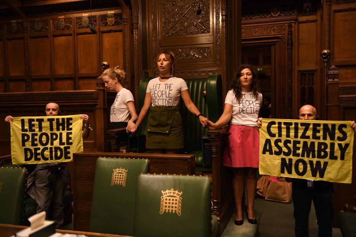 Extinction Rebellion Members Superglue Themselves in UK Parliament Chamber