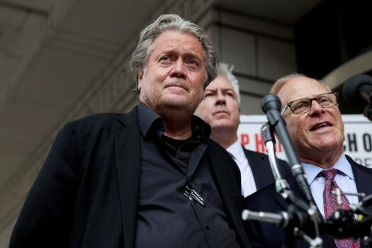 Former White House Chief Strategist Steve Bannon looks on as his attorney David Schoen speaks to reporters as he leaves the Federal District Court House at the end of the fourth day of his trial for contempt of Congress in Washington, on July 21, 2022. (Anna Moneymaker/Getty Images)