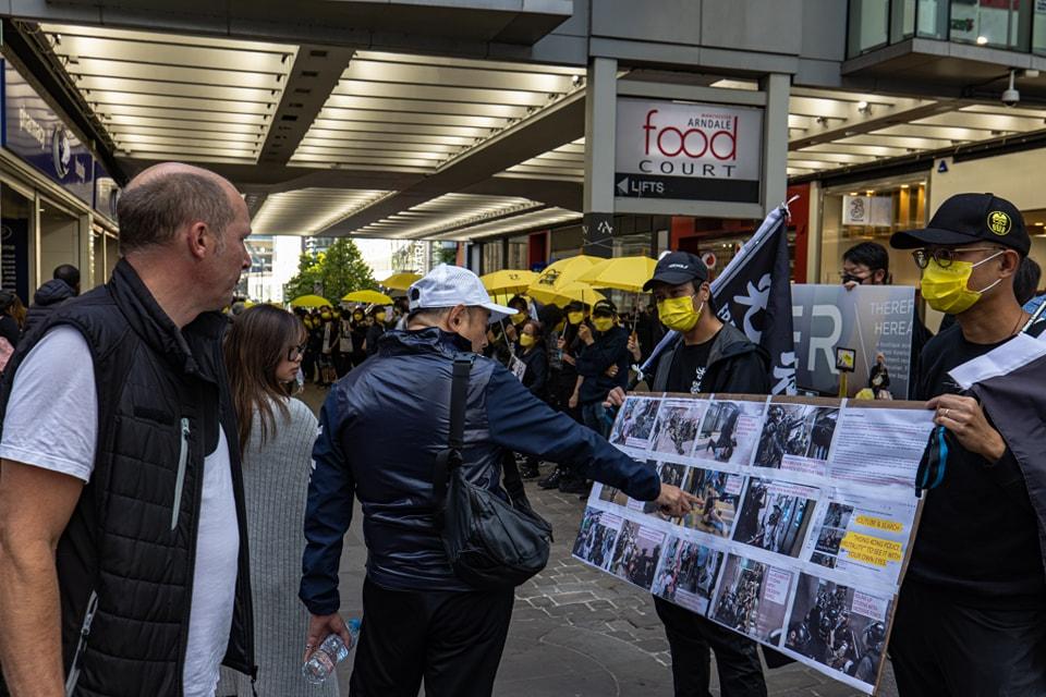 Hongkongers telling the truth of "831 Price Edward MTR Attack" to locals in Manchester City on Aug 31. 2022. (FB of Manchester Stands With Hong Kong)