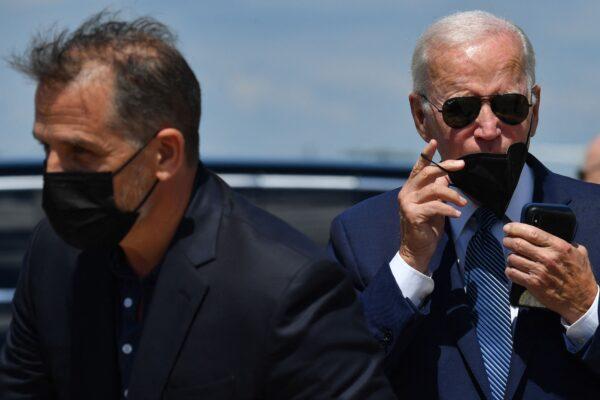 President Joe Biden, right, and his son Hunter Biden walk to a vehicle after disembarking Air Force One upon arrival at Joint Base Andrews in Maryland on Aug. 16, 2022. (Nicholas Kamm/AFP via Getty Images)