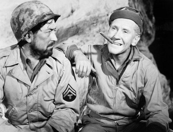 Private Dondaro (Wally Cassell, L) and Ernie Pyle (Burgess Meredith) in “Story of G.I. Joe.” (United Artists)