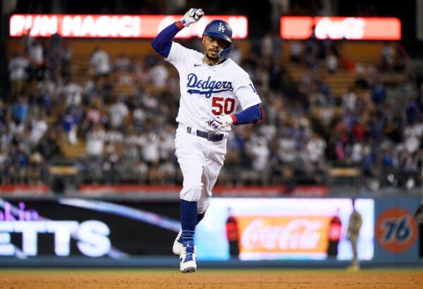 Mookie Betts (50) of the Los Angeles Dodgers celebrates after hitting three-run home run during the fourth inning against starting pitcher Sean Manaea (55) of the San Diego Padres at Dodger Stadium in Los Angeles, on Sept. 3, 2022. (Kevork Djansezian/Getty Images)
