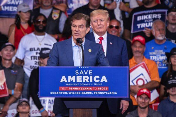 Mehmet Oz, who is running for the US Senate, speaks as former U.S. President Donald Trump stands behind him during a campaign rally at Mohegan Sun Arena in Wilkes-Barre, Pennsylvania on Sept. 3, 2022. (Ed Jones/AFP via Getty Images)