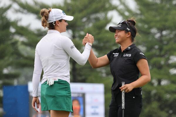Gaby Lopez of Mexico and Megan Khang of the United States embrace on the 18th green after their final round at the Dana Open presented by Marathon at Highland Meadows Golf Club in Sylvania, Ohio, on Sept. 4, 2022. (Gregory Shamus/Getty Images)