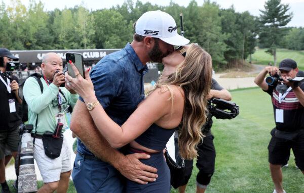 Dustin Johnson of the the United States kisses his wife Paulina after winning the LIV Golf Invitational - Boston at The Oaks golf course in Bolton, Mass., on Sept. 4, 2022. (Andy Lyons/Getty Images)