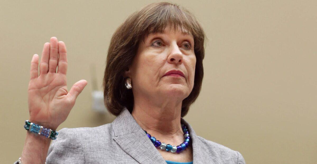 Nikole Flax, the IRS official in charge of a centralized office for 87,000 new agents, was part of the 2013 scandal exposing IRS targeting of conservative organizations. Pictured: Lois Lerner, then director of IRS' exempt organizations unit, is sworn in May 22, 2013, before a House committee investigating the scandal. (Chip Somodevilla/Getty Images)