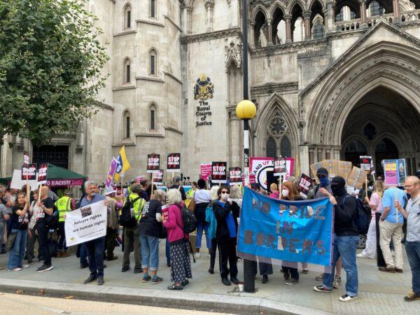 Demonstrators, protesting against the government's plan to send some illegal immigrants to Rwanda, outside the Royal Courts of Justice, central London, on Sept. 5, 2022. (PA)