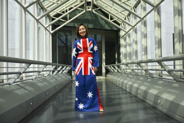 Independent MP for Fowler Dai Le poses for photographs in her Australian flag inspired dress after delivering her first speech in the House of Representatives at Parliament House in Canberra, Australia, on Sept. 5, 2022. (AAP Image/Lukas Coch)