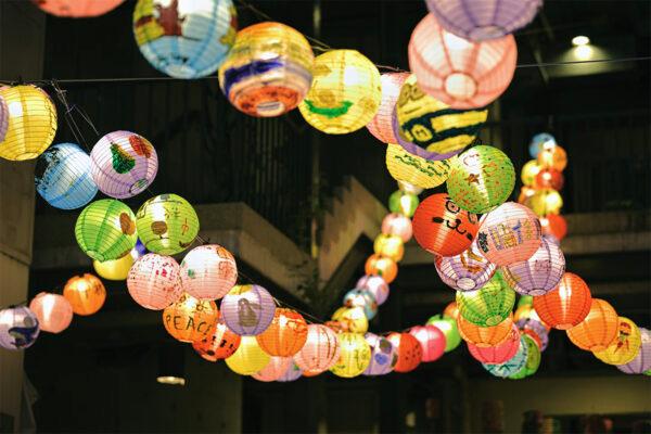 A close-up of some of the hand-painted lanterns hanging in the Blue House Cluster. (T M Chan/The Epoch Times)