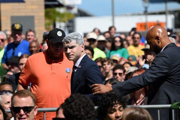 A man who heckled President Joe Biden as he spoke is removed from the Milwaukee Area Labor Council's annual Laborfest at Henry Maier Festival Park in Milwaukee, Wisconsin, on Sept. 5, 2022. (Mandel Ngan/AFP via Getty Images)