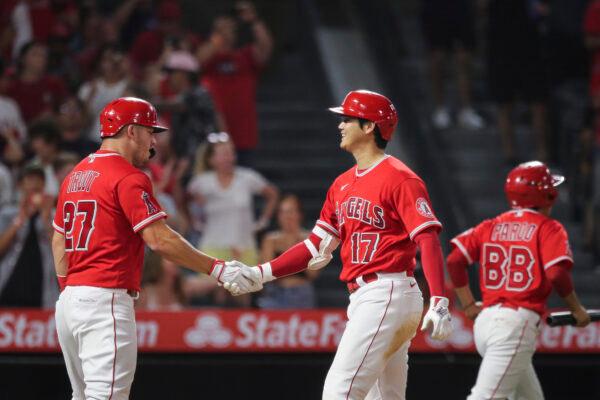 Shohei Ohtani (17) of the Los Angeles Angels celebrates his two-run home run with Mike Trout (27) in the third inning against the Detroit Tigers at Angel Stadium of Anaheim in Anaheim, Calif., on Sept. 5, 2022. (Meg Oliphant/Getty Images)