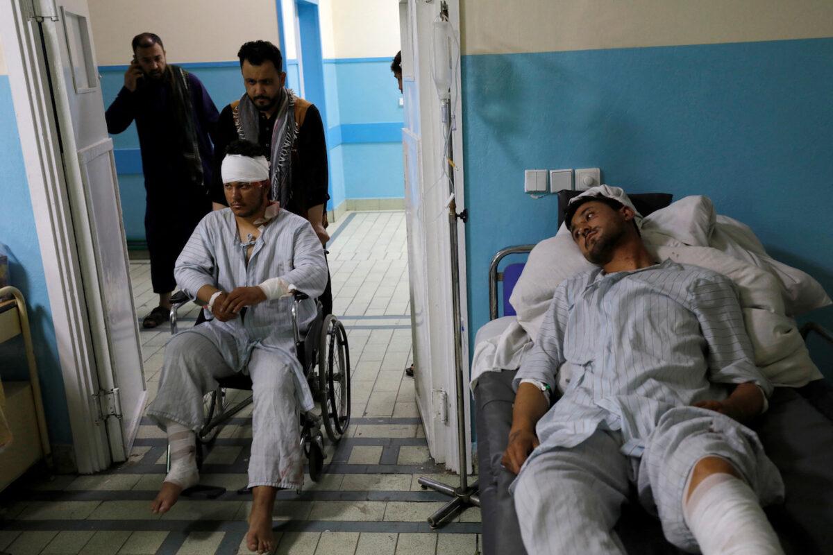  Men who were wounded after a suicide bomber detonated explosives near the entrance of the Russian embassy are being treated inside a hospital in Kabul, Afghanistan, on Sept. 5, 2022. (Ali Khara/Reuters)