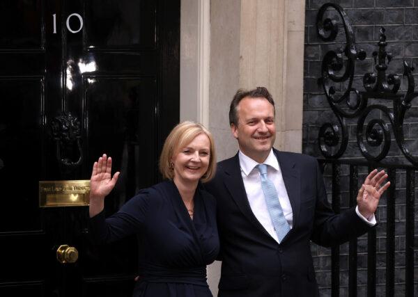 Prime Minister Liz Truss and husband Hugh O'Leary pose outside Number 10 after giving her first speech at Downing Street on Sept. 6, 2022. (Dan Kitwood/Getty Images)