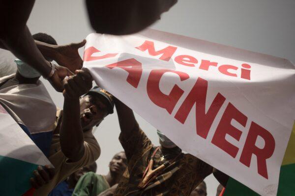 Protesters hold a banner reading "Thank you Wagner", the name of the Russian private security firm present in Mali, during a demonstration organised by the pan-Africanst platform Yerewolo to celebrate France's announcement to withdraw French troops from Mali, in Bamako, on February 19, 2022. (FLORENT VERGNES/AFP via Getty Images)