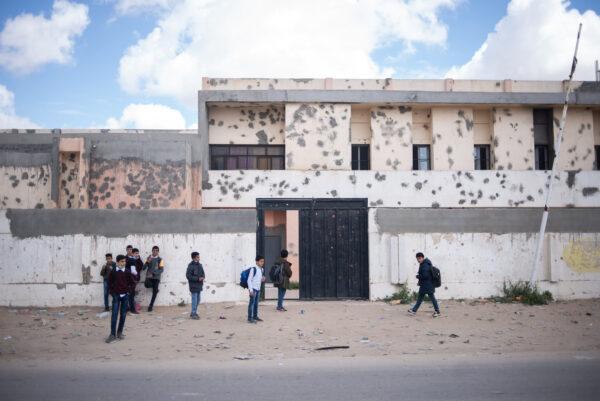 Students wait in front of Dar El-Baida elementary and middle school in southern Tripoli, Ain-Zara on March 22, 2022 Tripoli, Libya. (Nada Harib/Getty Images)
