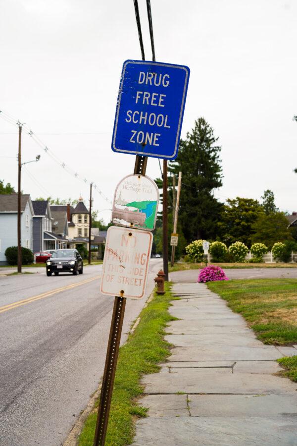A drug-free zone sign stands near a middle school in Port Jervis, N.Y., on Sept. 5, 2022. (Cara Ding/The Epoch Times)