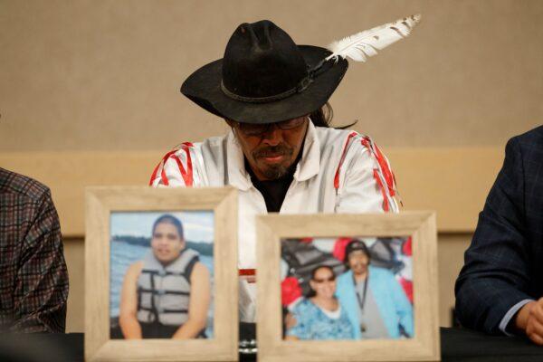 Brian Burns, father of James Smith Cree Nation stabbing victim Gregory, and husband to victim Bonnie, sits behind pictures of the victims during a news conference in Saskatoon on Sept. 7, 2022. (Cole Burston/AFP via Getty Images)