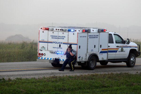 An RCMP officer at the scene where suspect Myles Sanderson was arrested, along Highway 11 in Weldon, Saskatchewan, on Sept. 7, 2022. (Lars Hagberg/AFP via Getty Images)