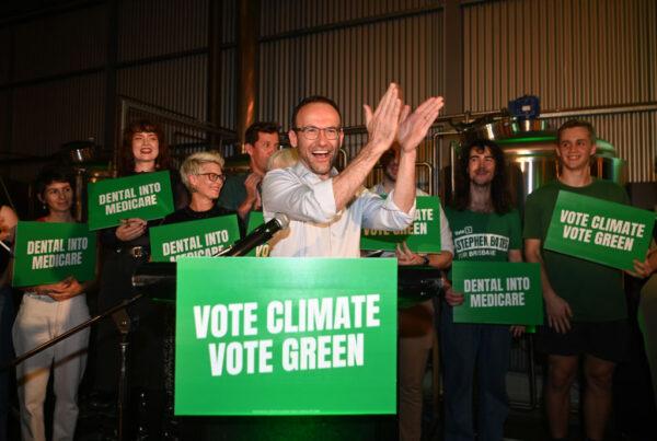 Australian Greens leader Adam Bandt (C) claps during the Greens national campaign launch at Black Hops Brewery in Brisbane, Australia, on May 16, 2022. (Dan Peled/Getty Images)