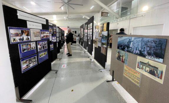 A man studies a display in the Public Exhibition on Crimes of Communism in Darra, Brisbane of Australia on Sept. 3, 2022. (Courtesy of Jenny Lai)