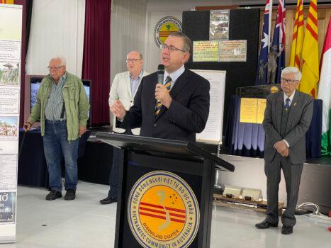Senator Paul Scarr of the centre-right Liberal Party, speaks at the Public Exhibition on Crimes of Communism standing alongside (R) Dr. Cuong Bui of the Vietnamese Community in Australia and (immediate L) Councillor Charles Strunk of the Brisbane City Council in Darra, Brisbane of Australia on Sept. 3, 2022. (Courtesy of Jenny Lai)