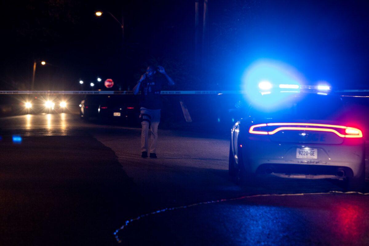 A police officer investigates at the scene where a man was taken into custody following a series of shootings throughout the city in Memphis, Tenn., on Sept. 7, 2022. (Brad Vest/Getty Images)