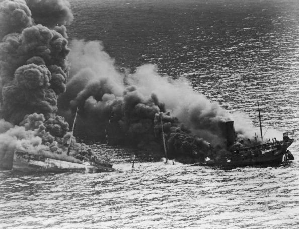 A convoy ship attacked and sunk in the Atlantic in March 1942 by a German submarine during World War II. (Hulton Archive/Getty Images)