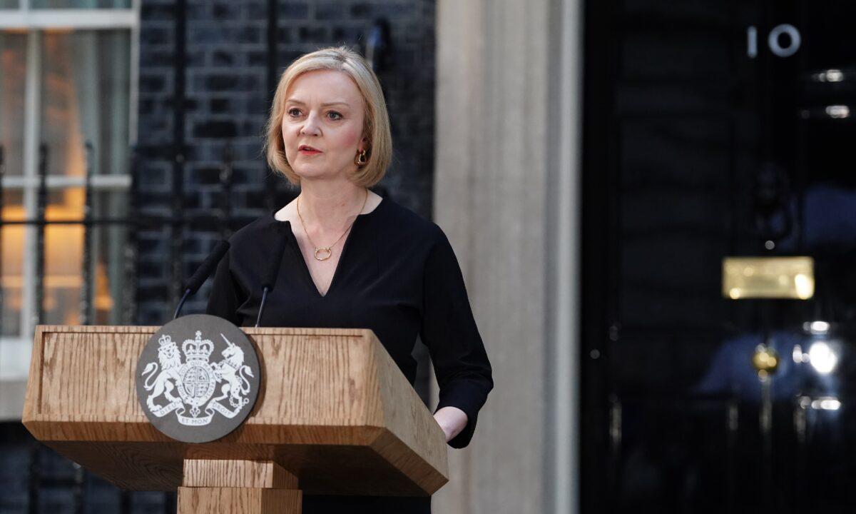 Prime Minister Liz Truss reads a statement outside 10 Downing Street, London, following the announcement of the death of Queen Elizabeth II on Sept. 8, 2022. (Ian West/PA Media)
