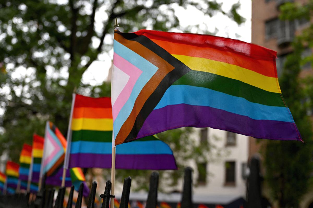 Flags representing LGBT social movements are posted outside the Stonewall Monument in New York on June 7, 2022. (Angela Weiss/AFP via Getty Images)